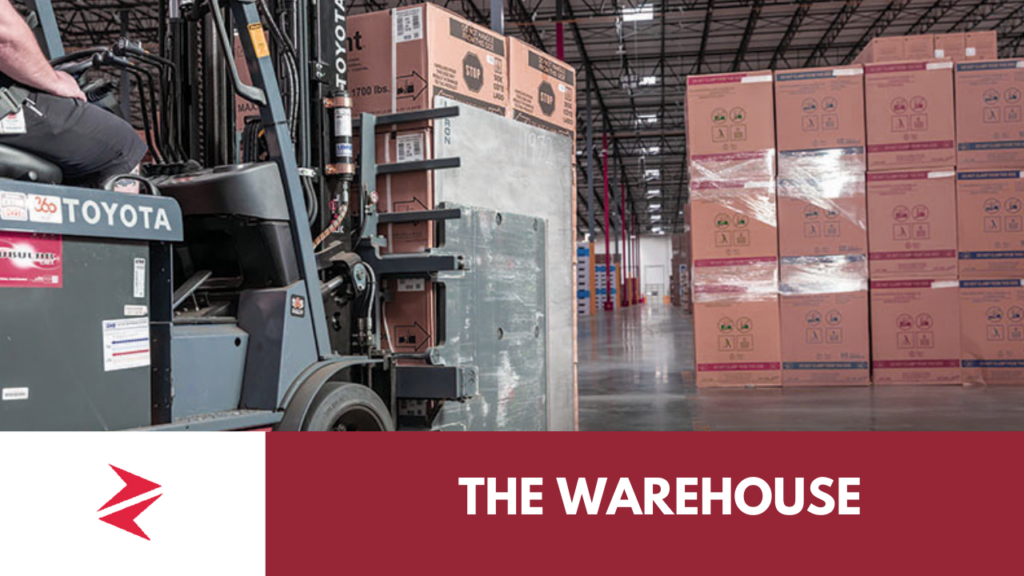 Forklift handling large home appliances inside a modern e-commerce warehouse fulfillment center