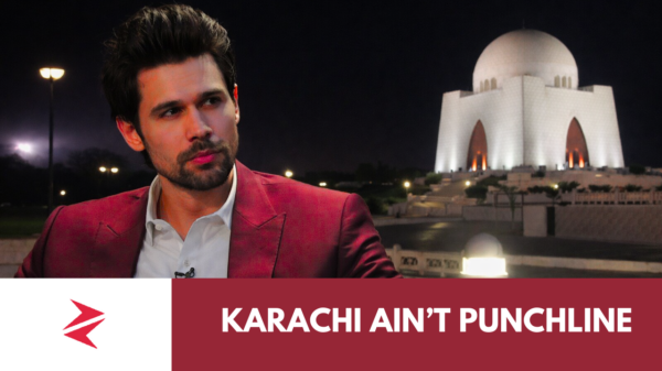 Man with Quaid-e-Azam Mausoleum at night