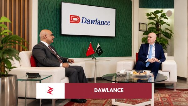 Dawlance Pakistan corporate meeting with Pakistan and Türkiye flags symbolising Beko investment, local manufacturing and appliance market revival.
