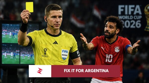 Referee François Letexier officiating the controversial Egypt vs Argentina FIFA World Cup match as Mohamed Salah questions a decision.