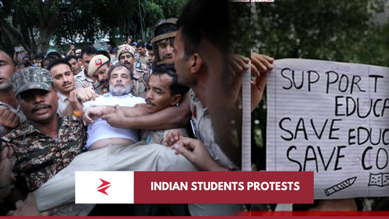 Indian security personnel carrying a detained protester beside a student placard during the July 2026 NEET demonstrations