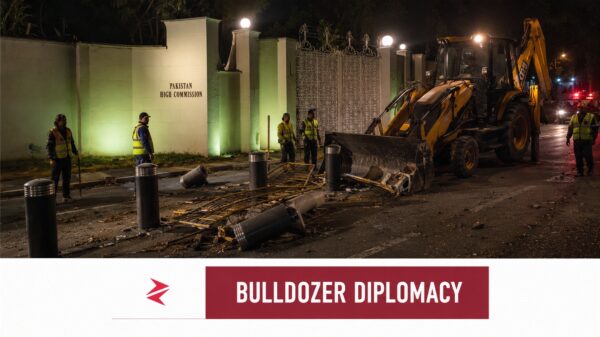 JCB removing security barriers outside Pakistan High Commission in New Delhi during India-Pakistan diplomatic dispute