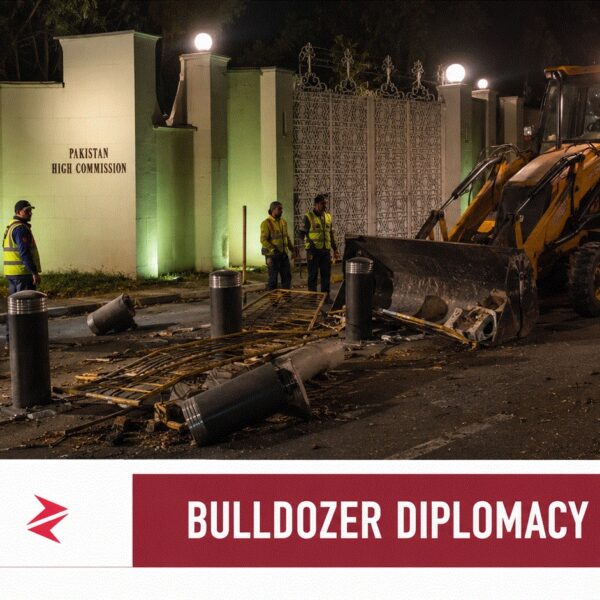 JCB removing security barriers outside Pakistan High Commission in New Delhi during India-Pakistan diplomatic dispute