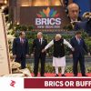 Narendra Modi at the BRICS 2026 photo-op beside the vegetarian state-dinner menu and an Indian official eating during a summit address